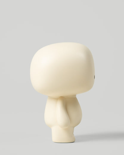 Blumo art toy figure, side profile view, on a plain grey background