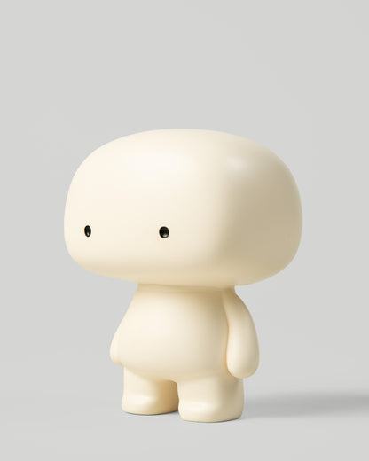 Blumo art toy figure, three-quarter view from the left, on a plain grey background