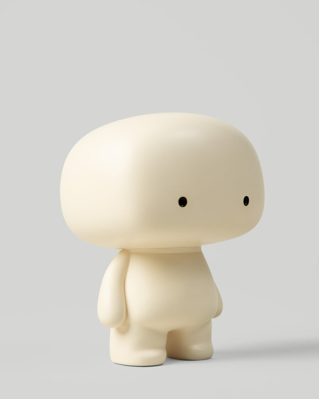 Blumo art toy figure, three-quarter view from the right, on a plain grey background